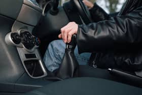 A driver changes gear.