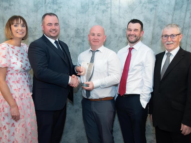 Philip McLaughlin, CLG Charn Domhnaigh collects the Sports Club of the Year Award, sponsored by Express Food Service from Davin Doherty at the Carndonagh Traders Business and Community Awards in the Ballyliffin Lodge Hotel on Saturday night last also included are Helen Nolan, Mark Nolan and Liam McLaughlin. Photo Clive Wasson.