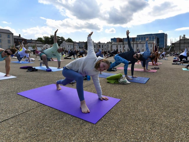 Participants at the Northlands Well Being Yoga event held in Ebrington Square on Saturday morning. The event was part of the Northlands 50th Anniversary Celebrations. Photo: George Sweeney