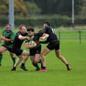 City of Derry’s Alex McDonnell is tackled by Connemara pair Ian Heanue and Shane Sweeney during last week's All Ireland Junior Cup tie. The out-half misses this weekend's trip to Carrick. Photo: George Sweeney
