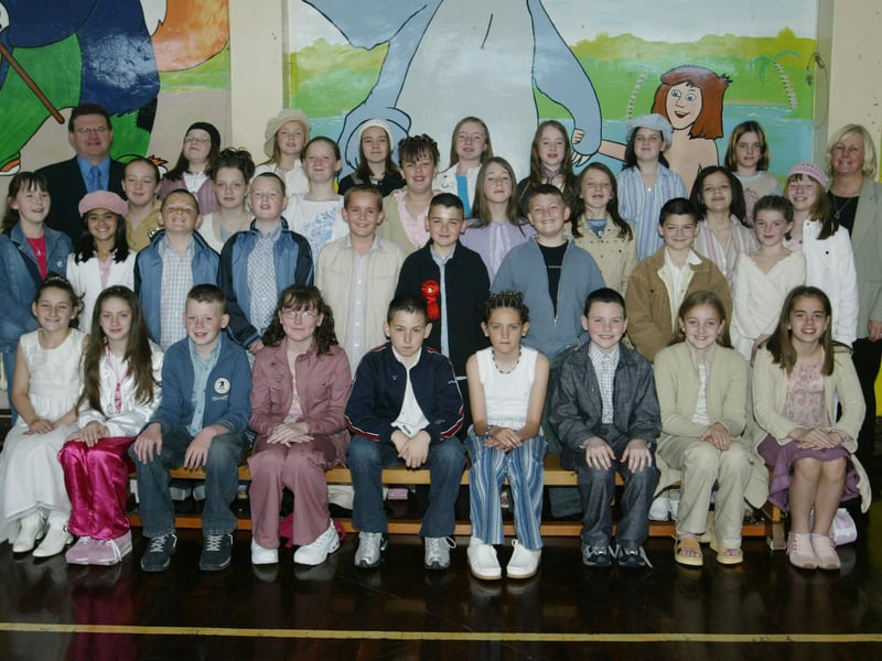 Holy child PS pupils who received the sacrament of Confirmation recently pictured here with class teacher Bill O'Donnell and school vice principal Brigid McLaughlin. (0905JB61)