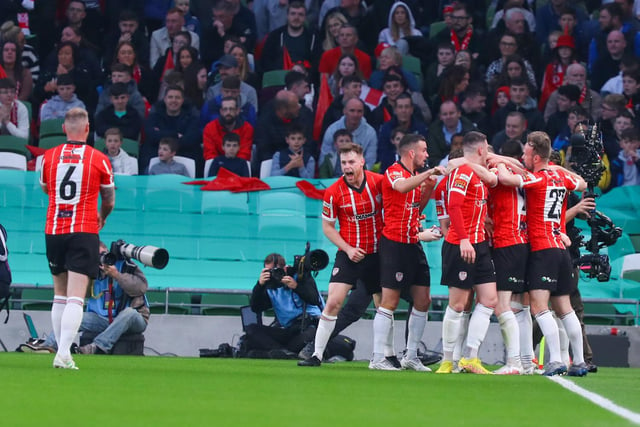 Derry City players mob Jamie McGonigle after the striker fired the Candystripes in front against Shelbourne in Sunday's FAI Cup Final in the Aviva Stadium. (Photo: Photo: Kevin Moore/MCI)