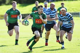 Simon Logue powers forward to set up the opening try of the match for City of Derry during Saturday's match against Ballymoney.