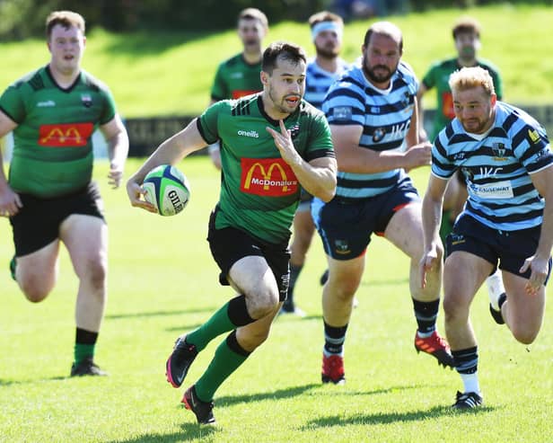Simon Logue powers forward to set up the opening try of the match for City of Derry during Saturday's match against Ballymoney.