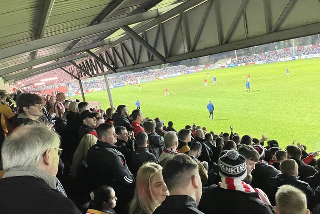 A cross section of Derry City fans at Richmond Park as they patiently await kick-off.