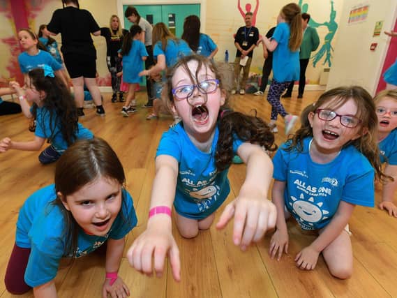 Some of the children from across the community who participated in the week long Good Relations, arts based, Summer Camps held at Studio, supported by Radius Housing Association. Photo: George Sweeney