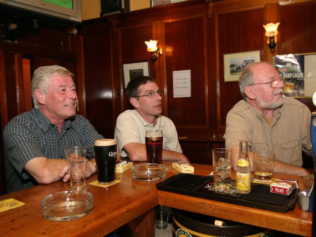 Punters enjoying a pint and good company while watching a match in the Alleyman's.