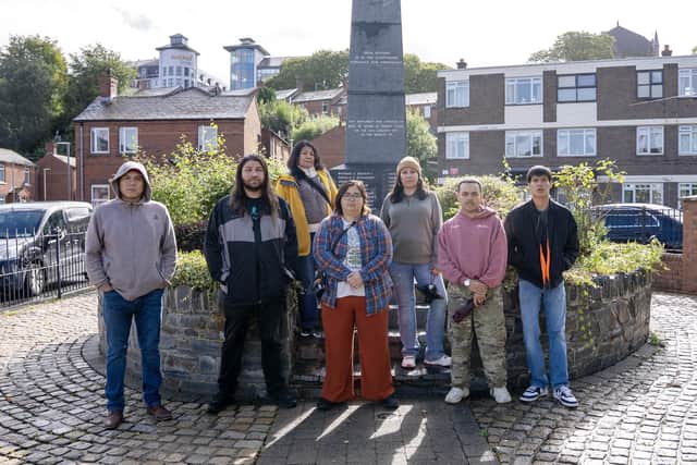 A delegation of indigenous activists including Krystal Two Bulls, Rafael 'Tufawon' Gonzalez Jr., Lynette Two Bulls, Cheyenna 'Chey' Morgan, Joseph White Eyes, Big Wind Carpenter and Mato White Plume at the Bloody Sunday monument.
