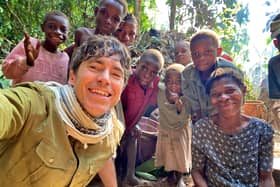 Simon Reeve with a remote Baka community in the Congo