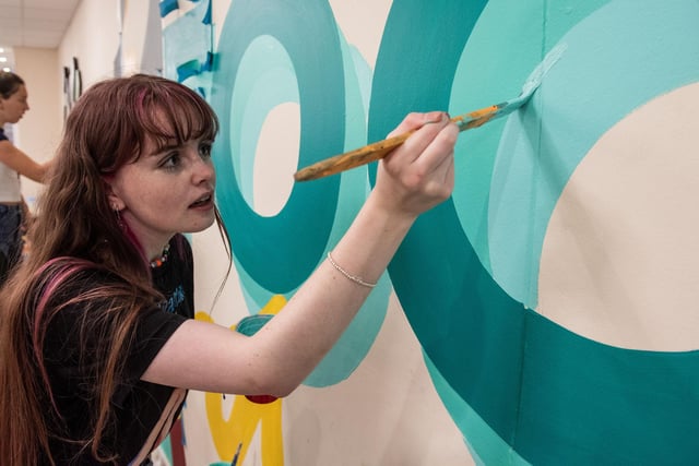 Art and design student Ciara Darcy gets to work painting the new mural at Strand Road campus during NWRC's Freshers' fest. 