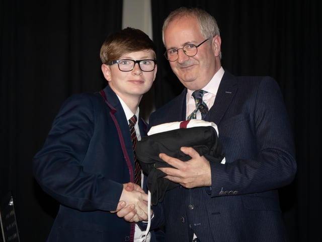 Corey Kennedy pictured receiving the Manchester United Foundation award for Contribution to Activities from Mr. Harkin.