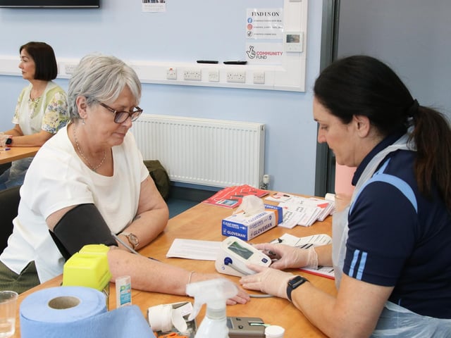 Eilís has her Blood Pressure checked by Aisling at Skeoge Community Health Fair.  (Photo - Deirdre Heaney, nwpresspics)