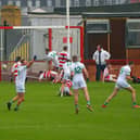 Craigbane’s Lee Moore (14) scores a first half goal against Ballerin in the Junior Football Championship final in Celtic Park on Sunday afternoon last. Photo: George Sweeney.  DER2241GS – 32