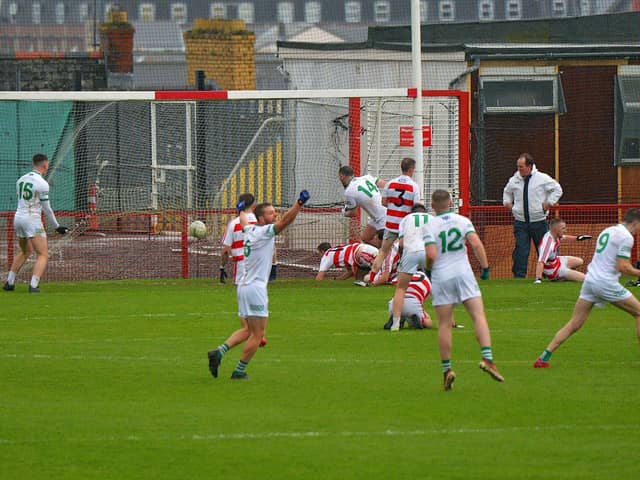 Craigbane’s Lee Moore (14) scores a first half goal against Ballerin in the Junior Football Championship final in Celtic Park on Sunday afternoon last. Photo: George Sweeney.  DER2241GS – 32