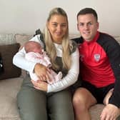 Derry City's Ben Doherty, his partner Shannon and their newborn baby daughter Enya.