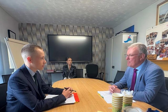 Health Minister Mike Nesbitt and Kian Hawes UK Youth Parliament, pictured at a table during their meeting.