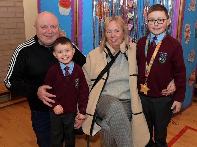 Jimmy Lyons and Patrica Collins with Michael and Finn at St John’s PS Grandparents Vintage Tea. Photo: George Sweeney
