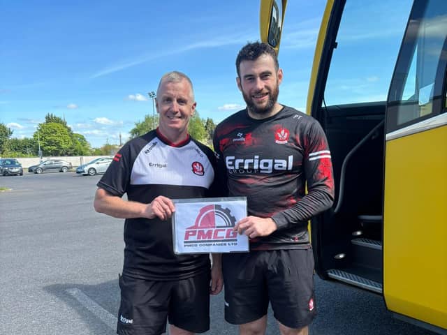 Derry's Patrick Turner receives his 'Player of the Match' award from manager Johnny McGarvey, representing award sponsors, Paul McGarvey Building Contracts, after Saturday's draw with Meath in Trim.