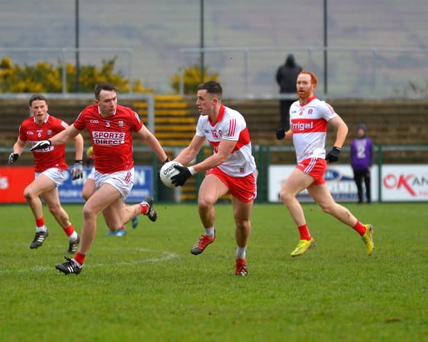 Shane McGuigan takes on Cork during last season's Division Two encounter Cork at Owenbeg. Photo: George Sweeney. DER2208GS - 002