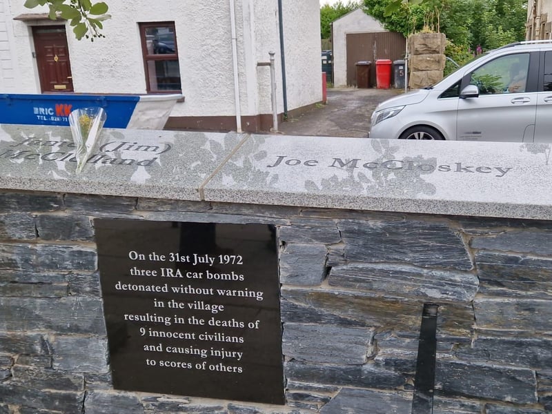 The names of those killed have now been inscribed into the new stone wall.