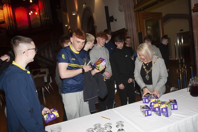 The Mayor Sandra Duffy handing out Easter eggs to the young Don Boscos FC 2007 at Friday night’s 50th anniversary event in the Guildhall.