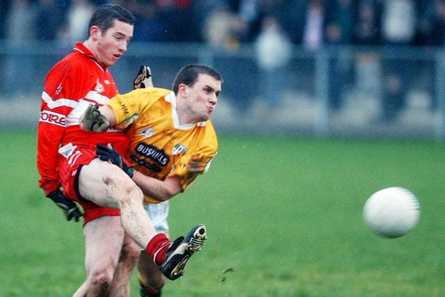 Derry's Dermot Scullion gets his shot away despite coming under pressure at Glen in January 2004.