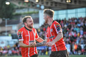 New signing Paul McMullan congratulates Derry City scorer Jamie McGonigle. Photo: George Sweeney