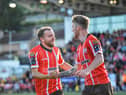 New signing Paul McMullan congratulates Derry City scorer Jamie McGonigle. Photo: George Sweeney