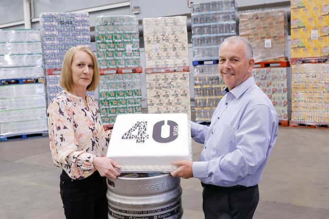 CHEERS TO 40 YEARS: United Wines Managing Director Martin McAuley and Sales Administrator Helena Smith celebrate 40 years of success for the company in Northern Ireland.