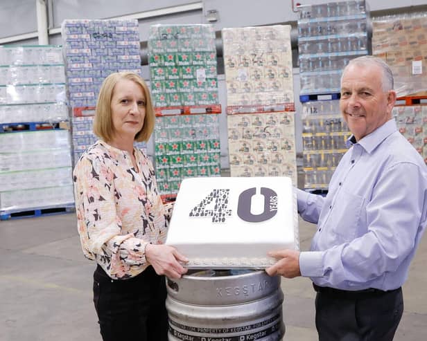 CHEERS TO 40 YEARS:  United Wines Managing Director Martin McAuley and Sales Administrator Helena Smith celebrate 40 years of success for the company in Northern Ireland.