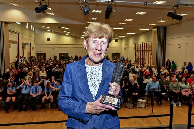 Mrs Joan Conaghan, sister of the late Fr Kevin Mullan pictiured with the new Feis Dhoie Fr Mullan Perpetual Memorial Award created by sculptor Rory Harron. Photo: George Sweeney
