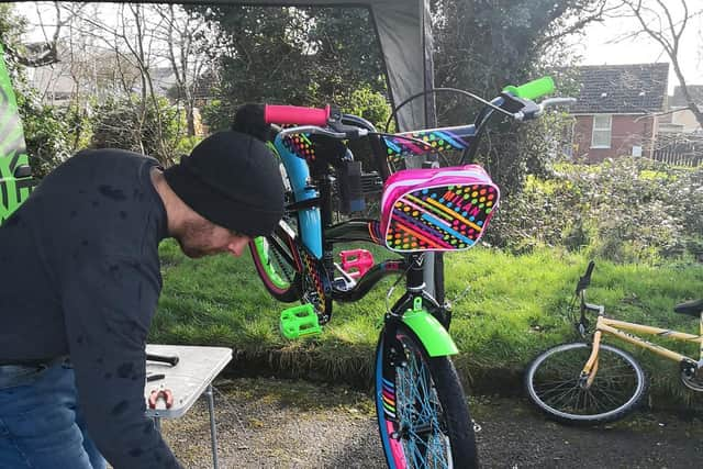 The Bike General: A child’s bike is made road-ready at Enagh Youth Forum’s Bicycle Safety Workshop, which was funded by the Housing Executive.