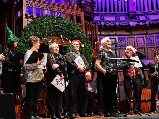Members of the HIVE choir sing at the Guildhall Christmas Fair on Friday afternoon. Photo: George Sweeney / Derry Journal