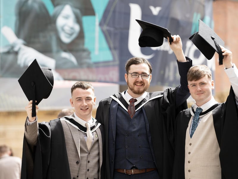 Music graduates Killian McCarron from Donegal; Cillian Reilly from Downpatrick; and Kevin Laughlin from Donegal celebrate as they graduate from Ulster University in Derry on Monday July 8. (Photo: Nigel McDowell / Ulster University)