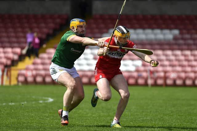 Shea Cassidy of Derry shields the sliothar from Meath’s Darragh Kelly. Photo:  George Sweeney