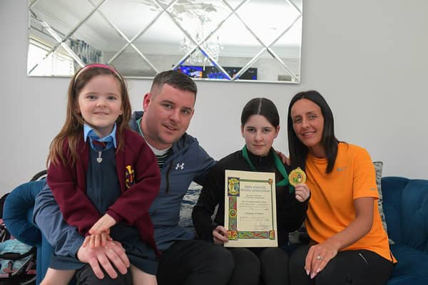 Shaniece  Robinson, winner of the Girl 1 National Title at 47 kilos, pictured with her dad Shaun, mum Danielle and sister Ciarsha . Photo: George Sweeney