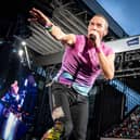 Coldplay performs at Parken Stadium in Copenhagen. Photo by Mads Claus Rasmussen / Ritzau Scanpix / AFP via Getty Images