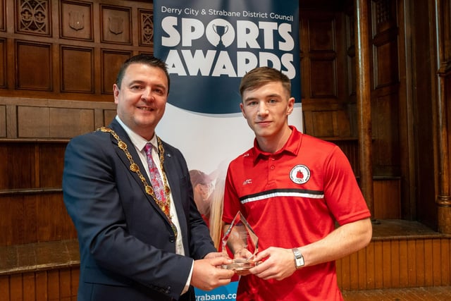 The Mayor, Councillor, Ruairí McHugh, presents Olympic Boxer Jude Gallagher from Two Castles Olympic Boxing Club, with Sports Star of the Year Award, as he hosted the annual Derry City and Strabane District Council Sports Awards in the Guildhall. Picture Martin McKeown. 05.06.25