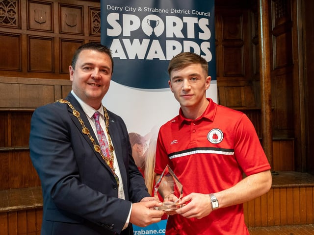 The Mayor, Councillor, Ruairí McHugh, presents Olympic Boxer Jude Gallagher from Two Castles Olympic Boxing Club, with Sports Star of the Year Award, as he hosted the annual Derry City and Strabane District Council Sports Awards in the Guildhall. Picture Martin McKeown. 05.06.25