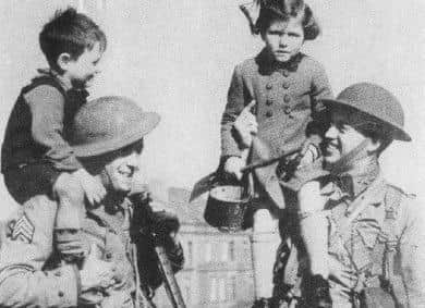 American GI's pictured in Derry with local Children