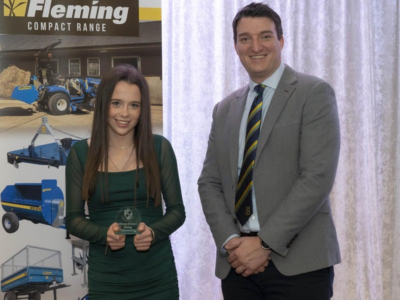 Jodie Spence from Newbuildings CC receives the 'Women's Championship Award' from Peter McCartney at the NW Cricket presentation evening.