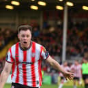 Grimsby Town bound Cameron McJannet celebrates Derry City's winner at Dalymount. Photograph by Kevin Moore.