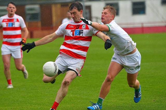 Jacob McElhinney of Craigbane moves in to tackle Ballerin’s Eugene Mullan during the JFC Final in Celtic Park on Sunday afternoon last. Photo: George Sweeney.  DER2241GS – 31