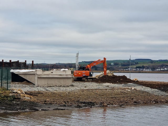 Works are steadily progressing on the new Derry bridge, which is due to be completed by Spring this year. The riverside path connecting the Bay Road Nature Reserve to the new bridge has kerbs and gravel laid and lampposts almost fully installed. The base for the bridge to sit on the Bay Road side seems to be fully complete with concrete being pored on the other side's base.