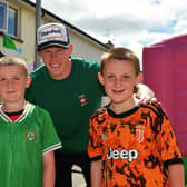Young fans pictured with James McClean during a street party held in Creggan Heights, to celebrate James winning his 100th international cap for the Republic of Ireland. Photo: George Sweeney. DER2325GS - 103