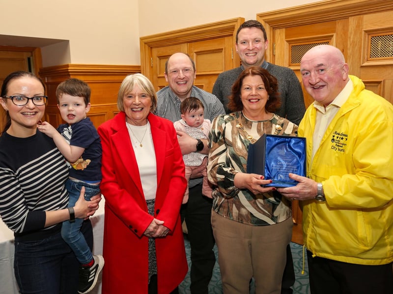 The Mayor of Derry and Strabane, Councillor Patricia Logue, presenting a civic gift to tour guide Garvin Kerr at a reception in the Guildhall on the occasion of his retirement after 18 years from Martin McCrossan City Tours. Included are Mrs. Marie Kerr, sons Emmet and Garvin, daughter-in-law Gemma and grand-children Oisin (3) and Clodagh (3months).
Credit ©Lorcan Doherty