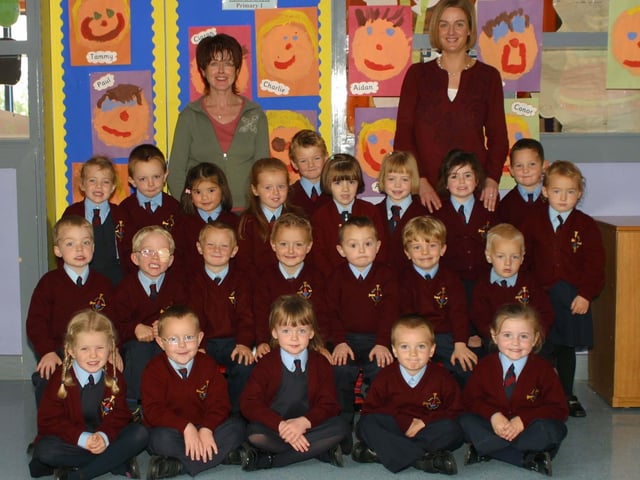 St. Eitne's Ps P1 pupils with classroom assistant Margaret Burns and class teacher Stephanie Doherty. (0310JB22):20 years on: Young people across Derry and Donegal starting school in September 2003