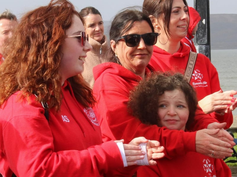 Louise and her daughter Rioghnach clapping to the singing before the walk.      (Photo - Deirdre Heaney, nwpresspics) : Buncrana Pier Tragedy 10th Anniversary Remembrance Walk. Photos: Deirdre Heaney, nwpresspics.