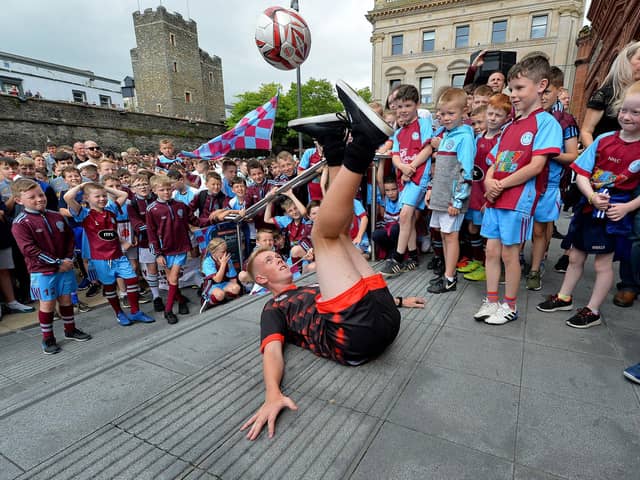 Tom Madden demonstrates his soccer skills, at Guildhall Square, during  the Foyle Cup City Centre parade.