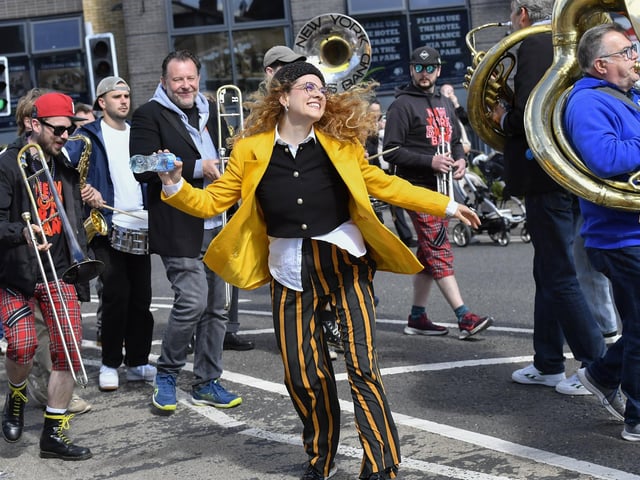 Reveller dancing at the Jazz Festival’s DLD Second Line Parade Saturday morning. Photo: George Sweeney
